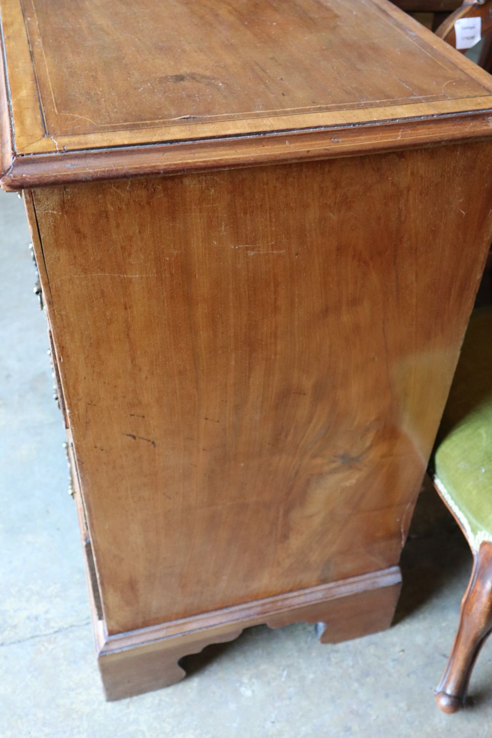 An Edwardian Georgian style mahogany chest with brushing slide and four graduated long drawers, on bracket feet, width 87cm